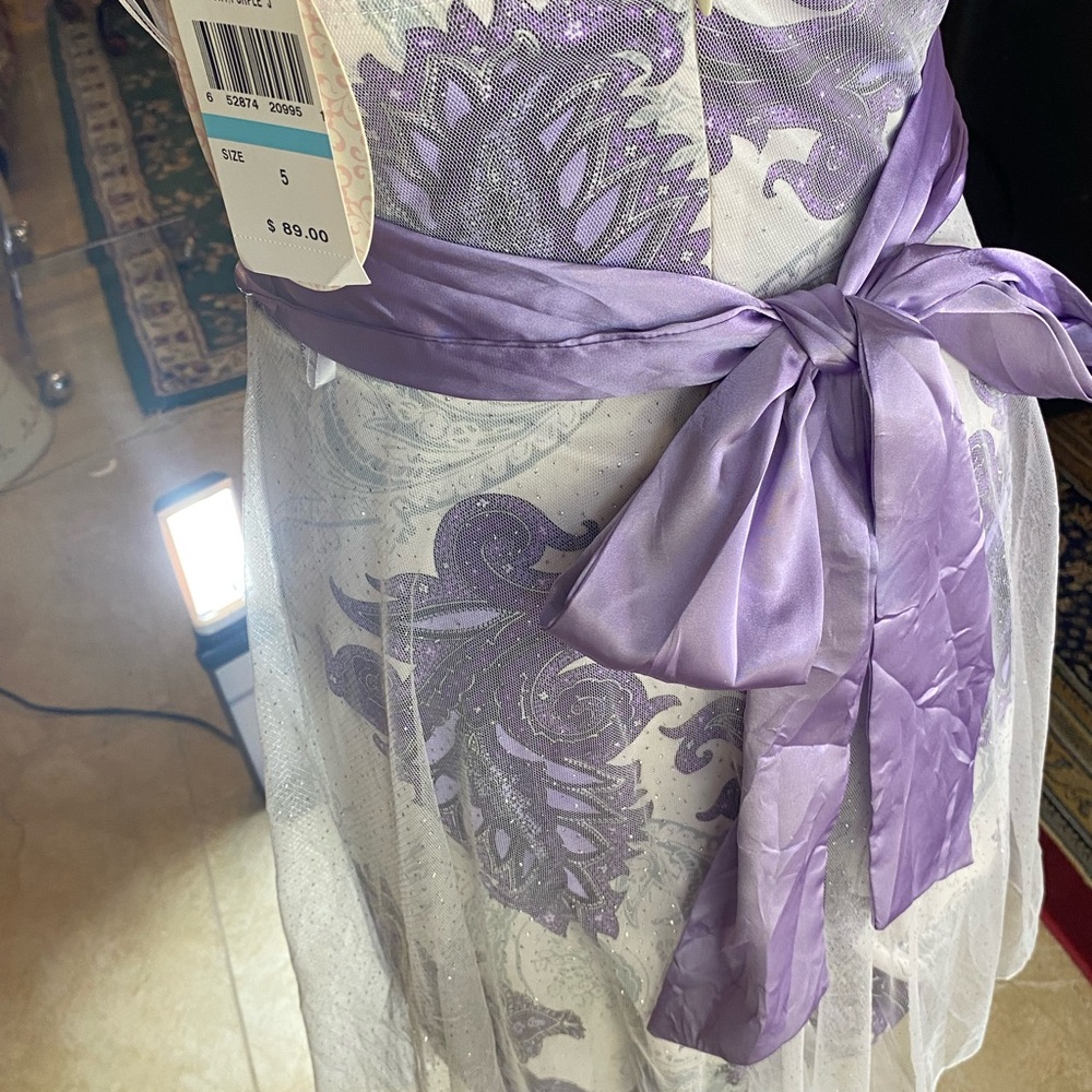 New ivory and purple dress size 5 with a touch of glitter.